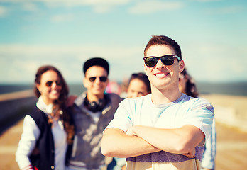 Image showing teenager in shades outside with friends