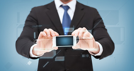 Image showing businessman showing smartphone with blank screen