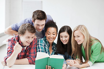 Image showing students reading book at school