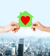 Image showing couple hands holding green paper house