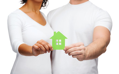 Image showing couple hands holding green house