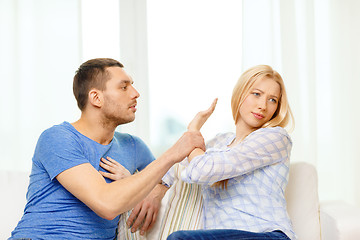 Image showing unhappy couple having argument at home