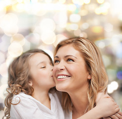 Image showing smiling mother and daughter hugging