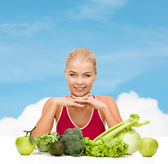 Image showing smiling sporty woman with organic food