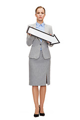 Image showing serious businesswoman with direction arrow sign