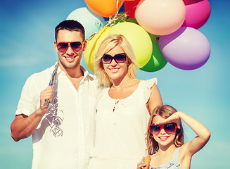 Image showing family with colorful balloons