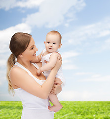 Image showing happy mother with adorable baby