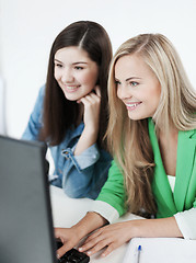 Image showing students looking at tablet pc at school