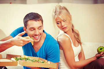 Image showing couple eating different food