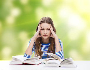 Image showing stressed student girl with books