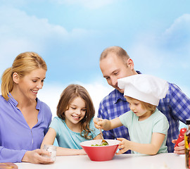 Image showing happy family with two kids eating at home