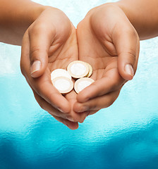 Image showing womans cupped hands showing euro coins