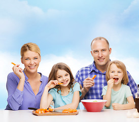 Image showing happy family with two kids eating at home