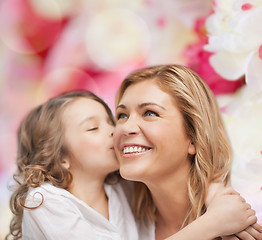 Image showing smiling mother and daughter hugging