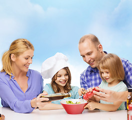 Image showing happy family with two kids eating at home