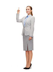 Image showing smiling businesswoman with her finger up