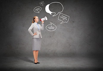 Image showing smiling businesswoman with megaphone