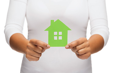 Image showing woman hands holding green house