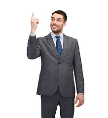 Image showing smiling businessman with finger up