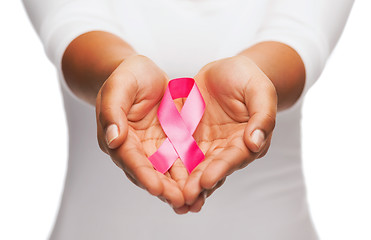 Image showing hands holding pink breast cancer awareness ribbon