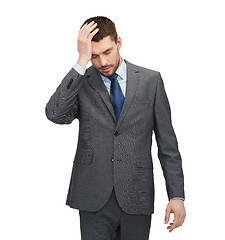 Image showing handsome businessman having headache