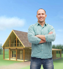 Image showing smiling man with crossed arms