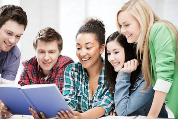 Image showing students reading book at school