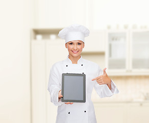 Image showing smiling female chef with tablet pc blank screen