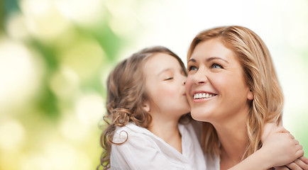 Image showing smiling mother and daughter hugging