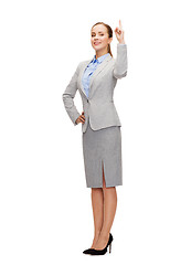 Image showing smiling businesswoman with her finger up