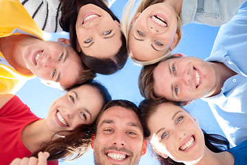 Image showing group of teenagers looking down