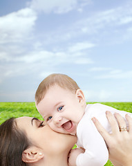 Image showing laughing baby playing with mother