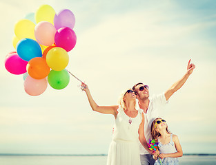 Image showing family with colorful balloons