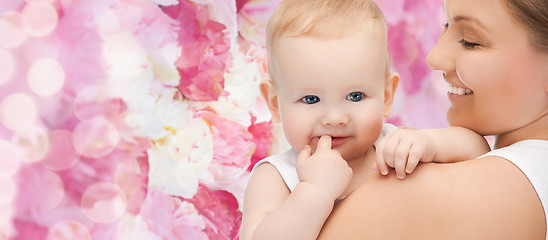 Image showing happy mother with adorable baby