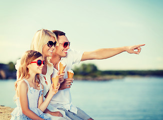 Image showing happy family eating ice cream