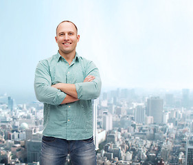 Image showing smiling man with crossed arms