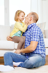 Image showing smiling father and daughter playing at home