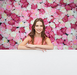 Image showing young woman in dress with white blank board