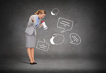 Image showing angry businesswoman with megaphone