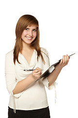 Image showing Business woman writing on clipboard