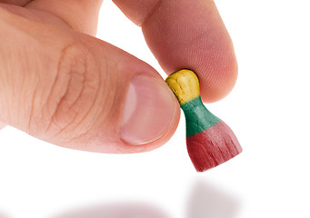 Image showing Wooden pawn with a painting of a flag