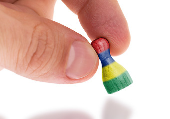 Image showing Wooden pawn with a painting of a flag