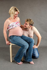 Image showing loving happy couple, smiling pregnant woman with her husband