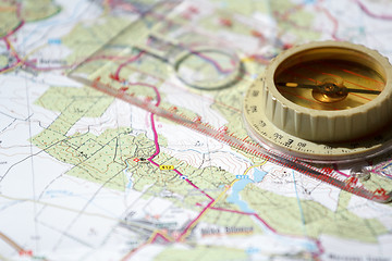 Image showing old touristic compass on map