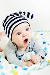 Image showing The blue-eyed baby yawning