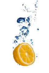 Image showing Fresh orange dropped into water with bubbles isolated on white