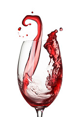 Image showing Splash of wine in glass isolated on white