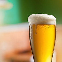 Image showing Glass of light beer in pub