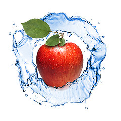 Image showing red apple with leaves and water splash isolated on white