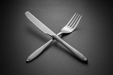 Image showing crossed knife and fork on black